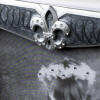 close up of this new orleans wedding guest book fleur de lis with rhinestone accents
