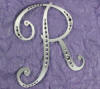 solid metal letter r with partially coverage of crystals wedding cake topper