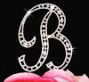 close up of letter b monogram wedding cake topper