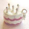 Sterling silver 3-D pink and white enamel birthday cake charm with 5 candles.