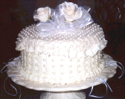 Here is a bridesmaid's charm cake with the cake charms under the cake - notice the ribbons.