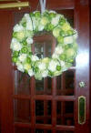 wedding wreath of flowers and fruit on entrance door