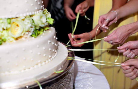 yellow ribbons on cake pulls - this charm cake was used as part of the wedding reception