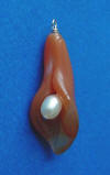 hand-carved carnelian calla lily pendant with freshwater pearl center