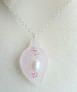 Genuine rose quartz with freshwater pearl and pink crystals sterling silver necklace.