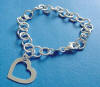 sterling silver charm bracelet with round links and heart tag