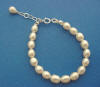 Flower girl freshwater pearl bracelet with sterling silver clasp and extender