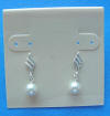 this bride's earrings are sterling silver dangle studs with 6mm white crystal pearls