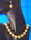 golden shell pearl necklace and earrings