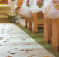 picture of a wedding aisle runner with flowers