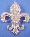 rhinestone covered new orleans fleur de lis wedding cake wedding gown brooch