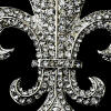 close-up of crystals on fleur de lis wedding brooch wedding cake jewelry