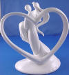 back side of bride and groom figurine glazed white porcelain wedding cake topper