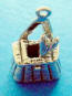 the fish tail comes out of the top of the basket on this 3-d fishing creel charm