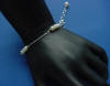 The matching sterling silver bracelet features 3 freshwater pearl stations to match the necklace and a 1" sterling silver chain extender with dangling freshwater pearl