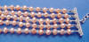 this necklace has 5 strands of pearls and beads
